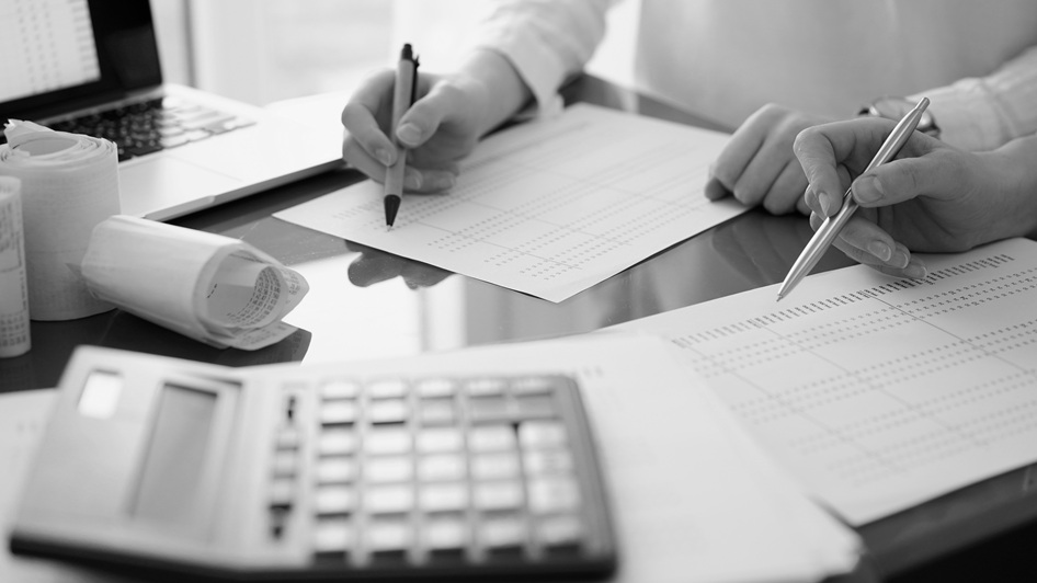 Hands writing on the paper